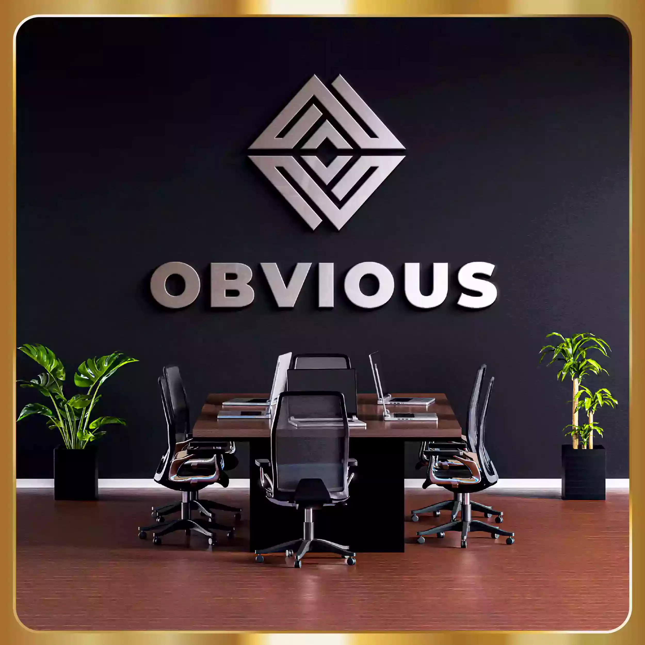 A creative design company logo on a black wall.